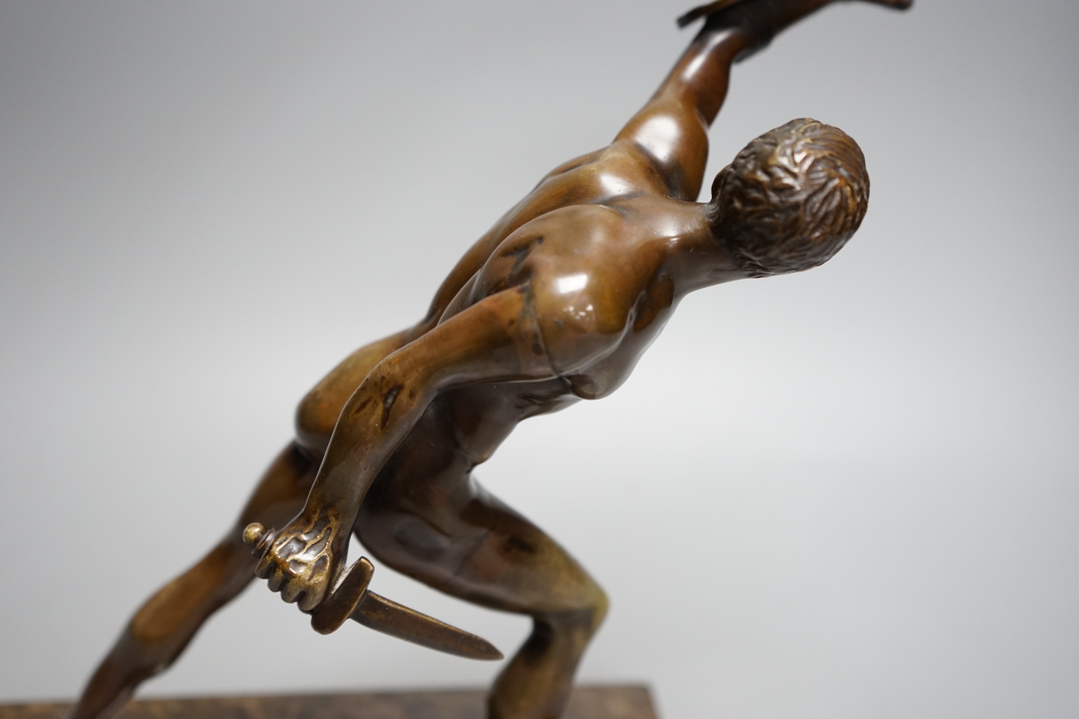 After the Antique, an early 20th century bronze study of the Borghese Gladiator, on marble base, 26cm tall